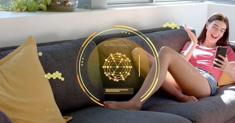 Young woman lounging on sofa using smartphone with augmented reality HUD holographic overlay