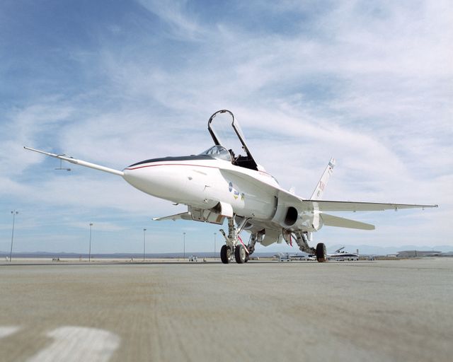 Features modified F/A-18A on runway, NASA Dryden Flight Research Center, California. Useful for topics on aerospace technology, engineering advances, aviation research, and government projects. Ideal for educational materials, articles on aerospace engineering, and aviation technology.