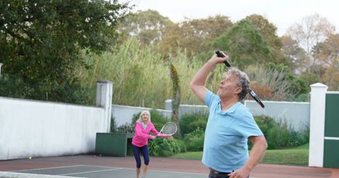 Senior Couple Playing Tennis Together for Active Lifestyle