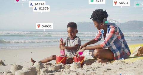 Parent and child building sandcastles on sunny beach with social media overlays and likes