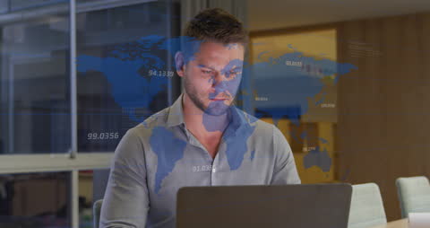 Businessman Analyzing Global Data on Laptop in Office