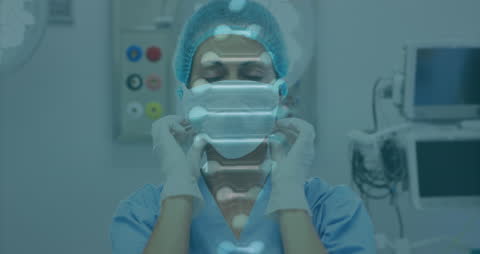 Animated DNA Overlay on Female Surgeon Donning Mask in Operating Room