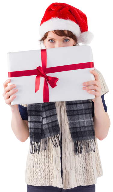 Woman Wearing Santa Hat Holding Christmas Present with Red Ribbon Transparent Background - Download Free Stock Videos Pikwizard.com