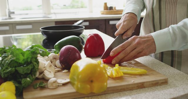 Close-Up of Person Cutting Fresh Vegetables in Modern Kitchen - Download Free Stock Images Pikwizard.com