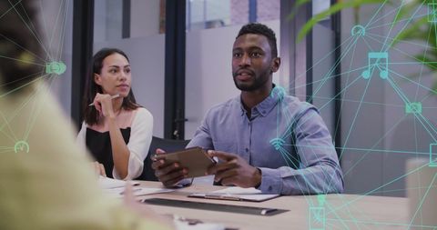 Diverse Team Exploring Digital Network Strategies in Modern Office