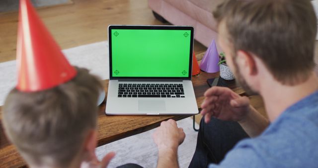 Father and Son Celebrating Birthday with Green Screen Laptop - Download Free Stock Images Pikwizard.com