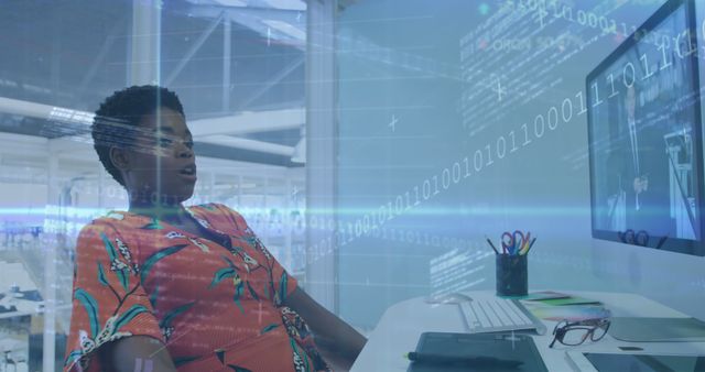 Composition of data processing and binary coding over african american woman using computer. Global connections, digital interface, computing and data processing concept digitally generated image.