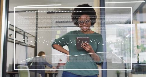 Businesswoman Interacting with Futuristic Data Graphics on Tablet