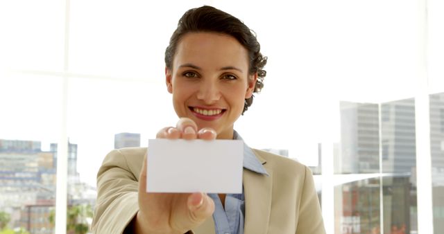 Professional Woman Holding Blank Business Card at Office - Download Free Stock Images Pikwizard.com