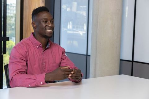Smiling Professional in Office Meeting Room with Copy Space