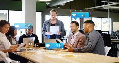 Team presenting in modern office with social media engagement overlays during meeting