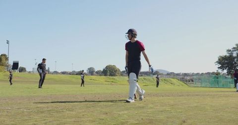 Youth Cricket Team Playing on Sunny Day