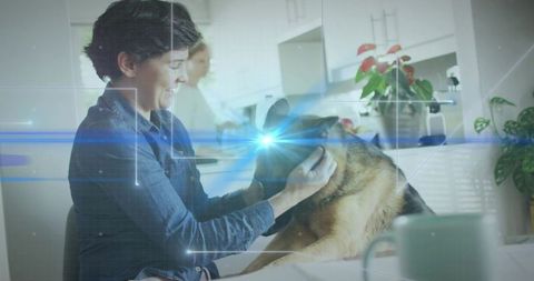 Smiling woman petting german shepherd in bright modern home kitchen with futuristic hud overlay