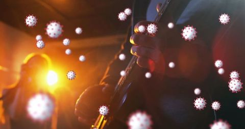Musician Playing Guitar with Virus Illustrations Overlay on Stage