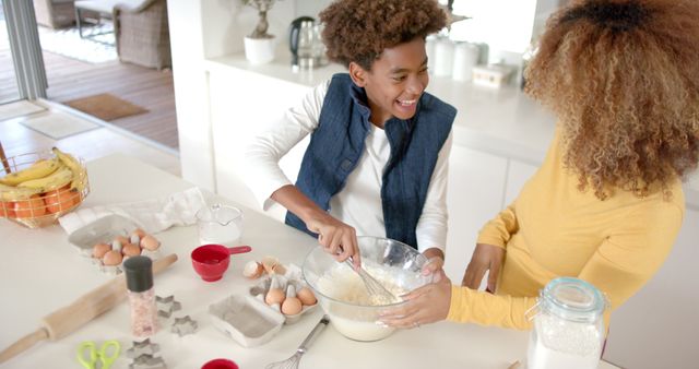 Happy African American Mother and Son Making Dough Together in Kitchen - Download Free Stock Images Pikwizard.com