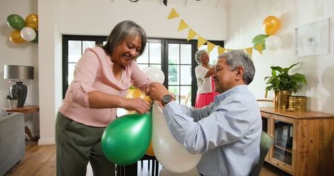 Seniors Decorating for Lively Birthday Party Celebration