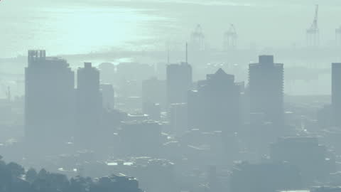 Abstract Red Mandala Patterns Over Foggy Cityscape