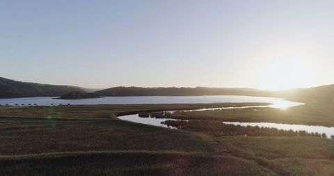 Tranquil River Landscape at Sunrise