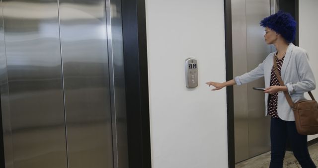 Person Waiting for Elevator in Modern Office Building - Download Free Stock Images Pikwizard.com