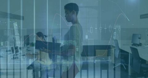 Businesswoman in Modern Office Analyzing Financial Charts and Data