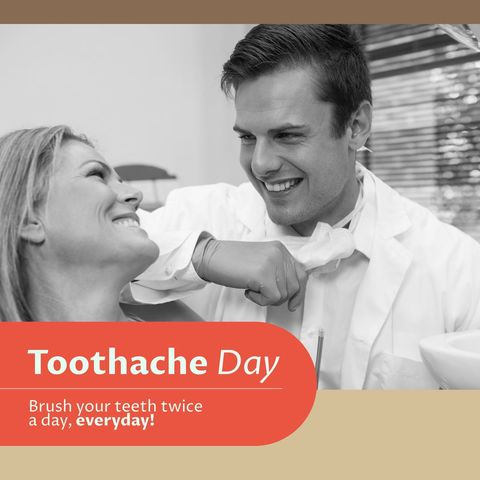 Smiling dentist sharing tips on toothache day with happy patient