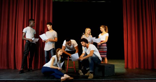 Group of Diverse Actors Rehearsing on Stage with Scripts - Download Free Stock Images Pikwizard.com