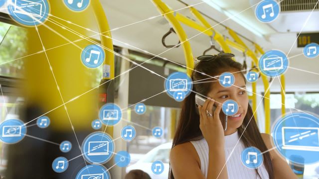 An video of a biracial woman using a smartphone on a bus, overlaid with digital connection and network icons symbolizing connectivity and technology. Suitable for use in promotional materials, articles, or presentations focused on public transit technology, digital communication systems, or contemporary urban lifestyle. Ideal for concepts in global connectivity, digital trends, or smart transportation solutions.