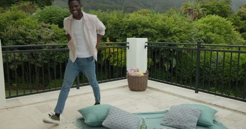 Man Preparing Romantic Terrace Picnic with Wine