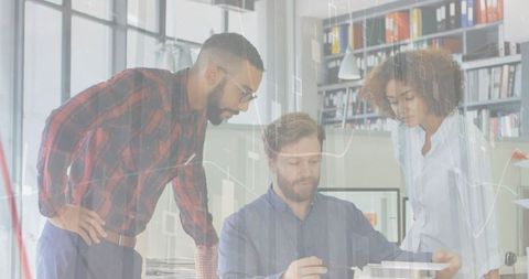 Colleagues Analyzing Data in Modern Office Interior