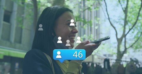 Woman Engaged with Smartphone on Busy City Sidewalk