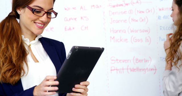 Female Executive Using Tablet During Meeting in Office - Download Free Stock Images Pikwizard.com