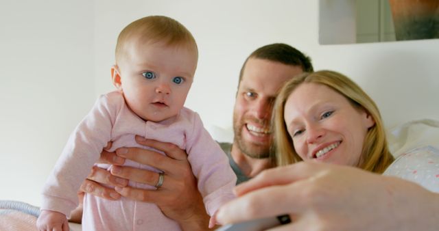 Young Family Taking Selfie with Infant at Home - Download Free Stock Images Pikwizard.com