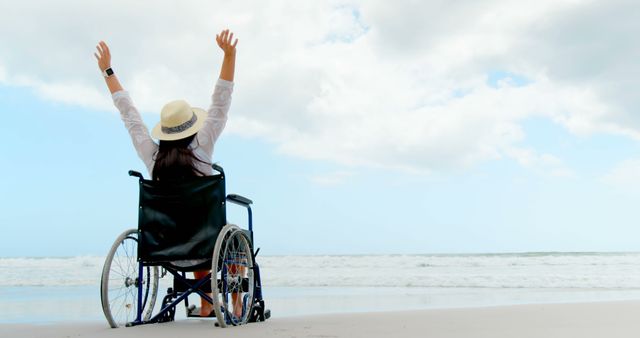 Celebrating Freedom at Beach in Wheelchair - Download Free Stock Images Pikwizard.com