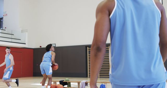 Basketball Players Practicing Shots in Indoor Gym - Download Free Stock Images Pikwizard.com