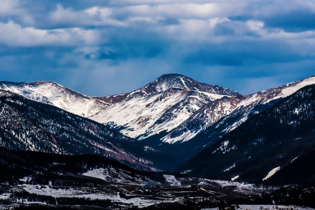 Snow-Capped Mountain Range under Dramatic Sky - Download Free Stock Photos Pikwizard.com