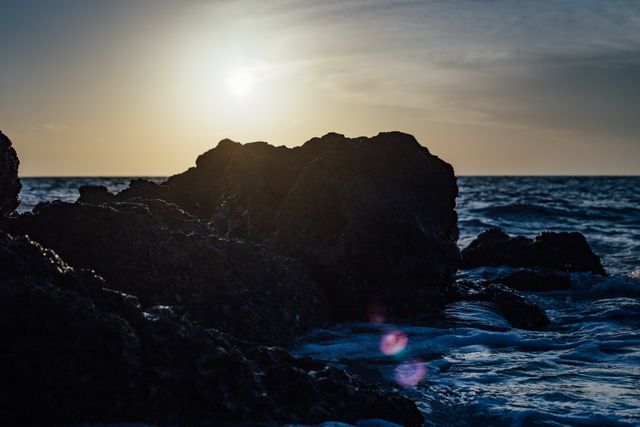 Tranquil Ocean at Sunset with Rocky Shoreline - Download Free Stock Images Pikwizard.com