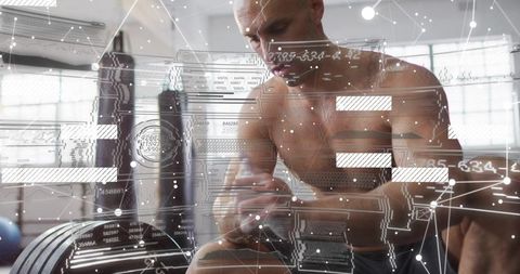 Shirtless athlete taping wrist before heavy lifting with futuristic data hud overlay