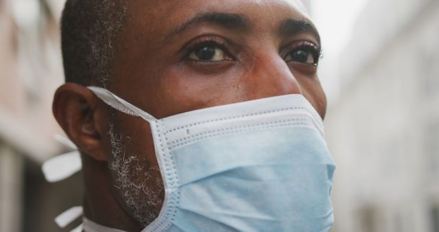 Close Up of Mature African American Man Wearing a Face Mask Outdoors - Download Free Stock Images Pikwizard.com