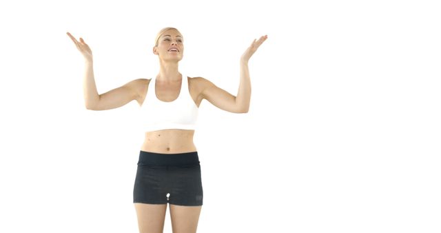 Energized Woman Excercising in Studio, Wearing Sports Attire - Download Free Stock Images Pikwizard.com