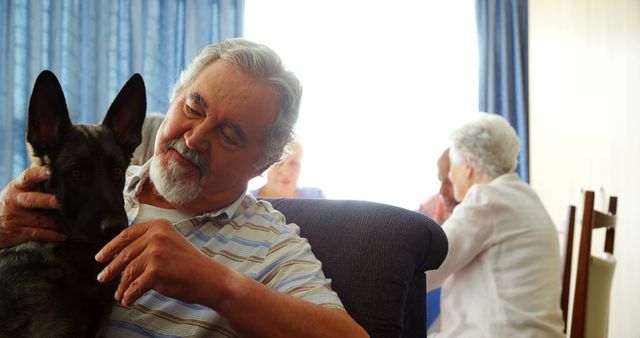 Senior Man with Dog at Nursing Home Social Gathering - Download Free Stock Images Pikwizard.com