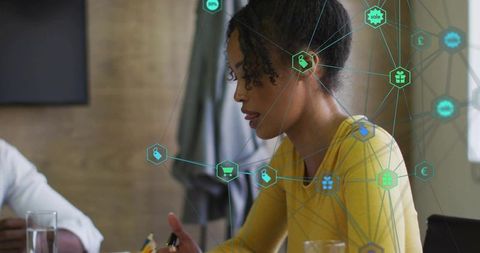 Woman speaking in team meeting with digital network and ecommerce icons overlay