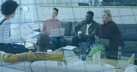 Informal business team meeting in modern office lounge