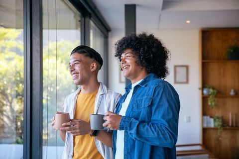 Diverse Friends Enjoying Coffee with Scenic Window View