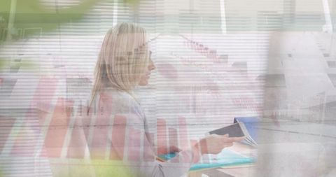 Digital Businesswoman Analyzing Data with Graph Overlay