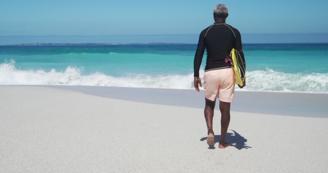 Senior Surfer Walking on Sandy Beach with Surfboard - Download Free Stock Images Pikwizard.com