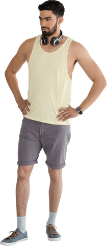 Transparent Image of Man Standing with Headphones and Hands on Hips