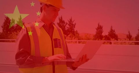 Engineer Inspecting Solar Panels with Futuristic Red Overlay