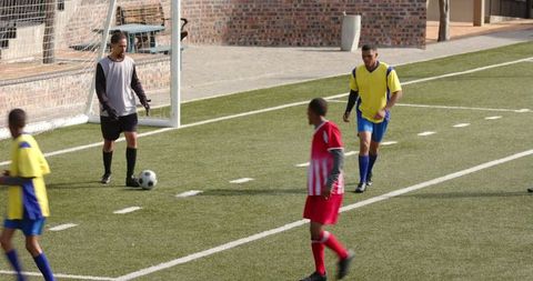 Youth Soccer Players Competing in Active Football Match