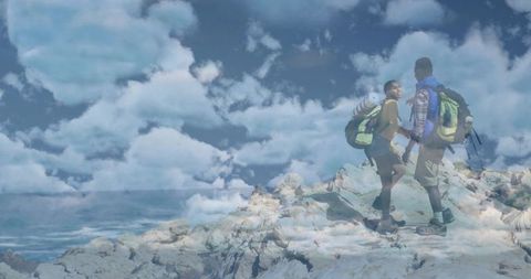 Couple Trekking with Gear Above Cloudy Summit