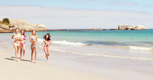 Group of Women Running on a Sandy Beach by the Sea - Download Free Stock Images Pikwizard.com